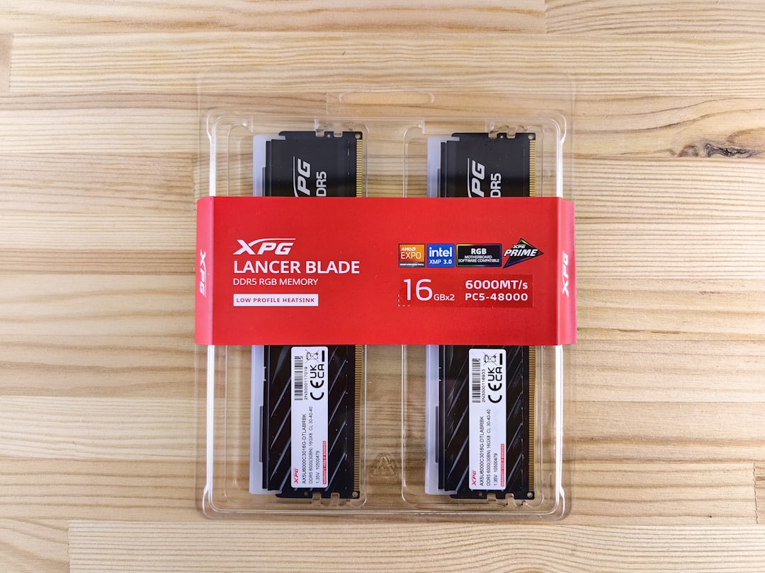 a-couple-of-batteries-sitting-on-top-of-a-wooden-table-o3zoco49zvk